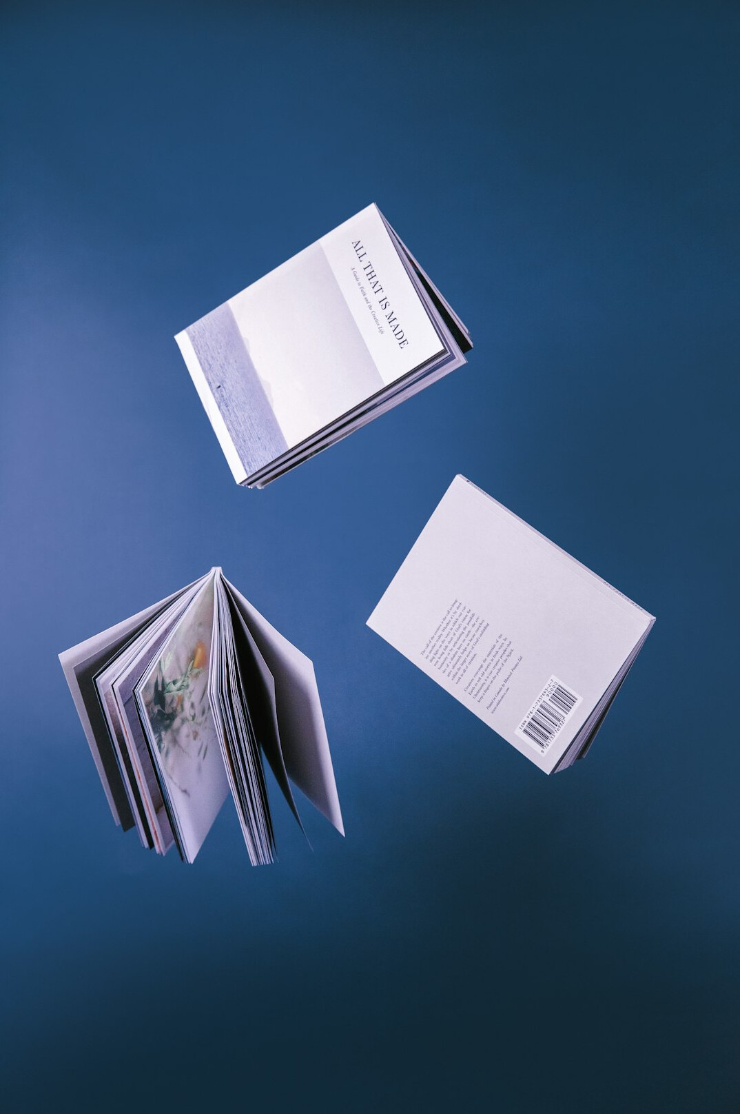 Stacked archive folders and documents on a wooden table